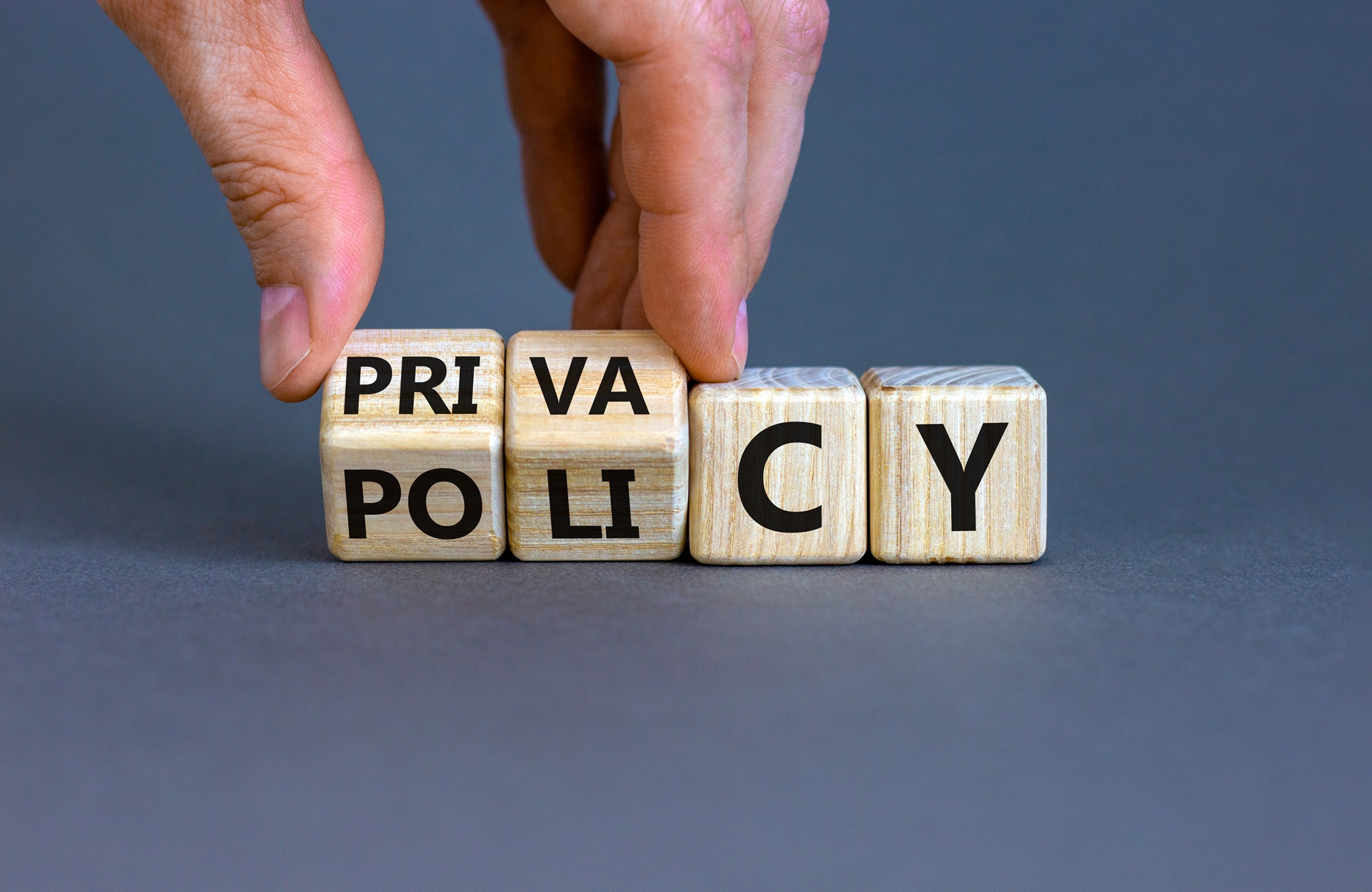 Privacy,Policy,Symbol.,Hand,Turns,The,Wooden,Cube,With,Words